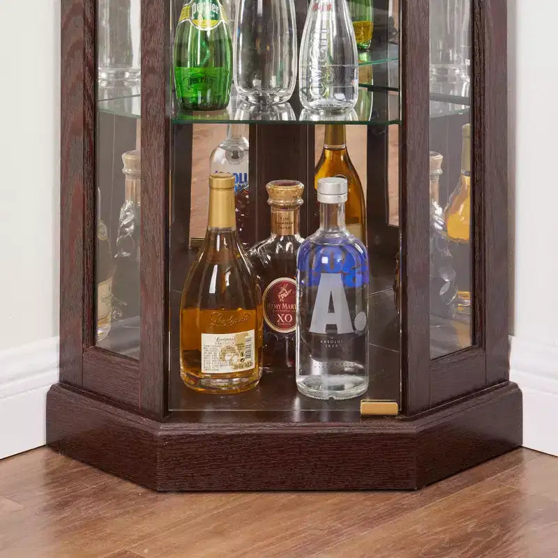 Vetrinetta ad angolo con illuminazione, adatta per soggiorni, collezioni di antiquariato, conservazione di vini o esposizione di bicchieri da bar. Legno di ciliegio scuro
